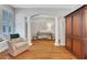 Bright open living room with hardwood floors, columns and neutral paint at 620 Neel Reid Dr, Roswell, GA 30075