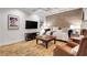 Cozy living room featuring hardwood floors, modern decor, and comfortable seating at 620 Neel Reid Dr, Roswell, GA 30075