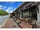 Outdoor seating with covered patio and multiple tables and chairs at 620 Neel Reid Dr, Roswell, GA 30075