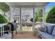 Relaxing porch with comfortable seating, a grill, and views of the neighborhood at 620 Neel Reid Dr, Roswell, GA 30075