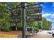 Directional sign pointing towards Oak St Shops, Barrington Hall, City Hall, and Bulloch Hall at 620 Neel Reid Dr, Roswell, GA 30075