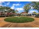 Town square with circular lawn and views of multiple business fronts at 620 Neel Reid Dr, Roswell, GA 30075