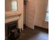 Bedroom featuring a window, fireplace, closet and door at 901 Mayson Turner Nw Rd, Atlanta, GA 30314