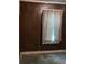 A bedroom with dark paneling and a curtained window at 901 Mayson Turner Nw Rd, Atlanta, GA 30314