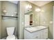 Bathroom showcasing the toilet, vanity, mirror, and other amenities at 130 Stewart Hollow Ln, Covington, GA 30016