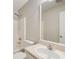 Clean bathroom featuring a shower-tub combo with handheld shower, toilet, and vanity with mirror at 130 Stewart Hollow Ln, Covington, GA 30016