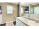 Bathroom featuring a large vanity with double sinks and a large mirror at 130 Stewart Hollow Ln, Covington, GA 30016