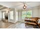 Bright dining area featuring a built-in breakfast nook, wood floors, and a charming light fixture at 130 Stewart Hollow Ln, Covington, GA 30016