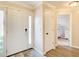 Bright foyer featuring durable hard surface floors with entry to a bedroom with white bunk beds and dresser at 130 Stewart Hollow Ln, Covington, GA 30016