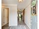 Hallway with hard surface floors and a barn door feature at the end of the hall at 130 Stewart Hollow Ln, Covington, GA 30016