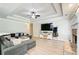 This is the living room which has a sectional couch and fireplace at 130 Stewart Hollow Ln, Covington, GA 30016