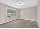 Carpeted bedroom with a large window at 2055 Pinella Dr, Grayson, GA 30017