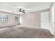 Bedroom features carpet, two windows, and a ceiling fan at 2055 Pinella Dr, Grayson, GA 30017
