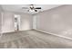 Neutral Primary bedroom featuring a ceiling fan and an ensuite bathroom at 2055 Pinella Dr, Grayson, GA 30017