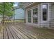 Wooden deck with a railing, accessible through double doors at 2055 Pinella Dr, Grayson, GA 30017