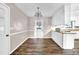 Dining Room features wood flooring, a decorative chandelier, and access to the kitchen at 2055 Pinella Dr, Grayson, GA 30017