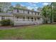 Charming two-story home with a large, covered front porch and well-maintained lawn at 2055 Pinella Dr, Grayson, GA 30017