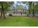Inviting home with a spacious front yard and a welcoming covered porch at 2055 Pinella Dr, Grayson, GA 30017