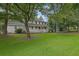 Traditional two-story house featuring a large front porch and green lawn at 2055 Pinella Dr, Grayson, GA 30017