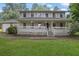 Charming two-story home featuring a welcoming front porch and well-maintained lawn at 2055 Pinella Dr, Grayson, GA 30017