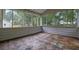 Enclosed sunroom with a tiled floor and screens all around at 2055 Pinella Dr, Grayson, GA 30017