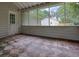 Enclosed sunroom with a tiled floor and screens all around at 2055 Pinella Dr, Grayson, GA 30017