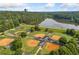 Aerial view showcasing baseball fields and park amenities near a lake at 4304 Berkford Ne Cir, Brookhaven, GA 30319