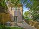 Brick exterior, quaint backyard with stone steps, and cozy outdoor space for relaxing at 4304 Berkford Ne Cir, Brookhaven, GA 30319