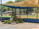 Statue at the entrance to the baseball field with blue seating, shade and flowers at 4304 Berkford Ne Cir, Brookhaven, GA 30319