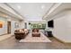 Open basement featuring tile flooring, leather seating, pool table, and a large television at 4304 Berkford Ne Cir, Brookhaven, GA 30319