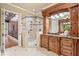 Bathroom featuring a glass-enclosed shower, vanity, and access to the hallway at 4304 Berkford Ne Cir, Brookhaven, GA 30319