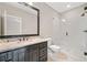 Bathroom featuring granite counters, tile flooring, and a glass door shower at 4304 Berkford Ne Cir, Brookhaven, GA 30319