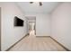 Empty bedroom with carpet flooring, a fan, and television mounted on the wall at 4304 Berkford Ne Cir, Brookhaven, GA 30319