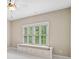 Bedroom featuring a window seat with storage, ceiling fan and bright natural light at 4304 Berkford Ne Cir, Brookhaven, GA 30319