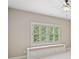 Bedroom featuring a window seat with storage, ceiling fan and natural light at 4304 Berkford Ne Cir, Brookhaven, GA 30319