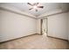 Large carpeted bedroom with ceiling fan and natural light from windows at 4304 Berkford Ne Cir, Brookhaven, GA 30319