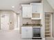 Wet bar in bonus room with granite countertops and shelving at 4304 Berkford Ne Cir, Brookhaven, GA 30319
