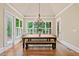 Bright dining room filled with natural light boasts charming chandelier at 4304 Berkford Ne Cir, Brookhaven, GA 30319
