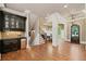Spacious foyer featuring hardwood floors, staircase, butler's pantry and arched doorway at 4304 Berkford Ne Cir, Brookhaven, GA 30319