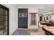 Basement game area with a dart board, pool cue rack, and access to outdoor living space at 4304 Berkford Ne Cir, Brookhaven, GA 30319