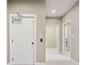 Hallway showcasing neutral paint, door, and access to other rooms at 4304 Berkford Ne Cir, Brookhaven, GA 30319