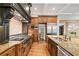 Gourmet kitchen boasts stainless steel appliances and granite countertops at 4304 Berkford Ne Cir, Brookhaven, GA 30319