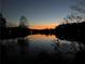 Sunset view of the serene lake at dusk at 4304 Berkford Ne Cir, Brookhaven, GA 30319