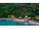 Relaxing backyard pool with lush landscaping and decorative water features offers a serene escape at 4304 Berkford Ne Cir, Brookhaven, GA 30319
