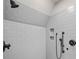 Bright tiled shower with dual shower heads and corner shelving at 4304 Berkford Ne Cir, Brookhaven, GA 30319
