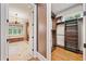 View of a walk-in closet with a chandelier, leading to the bathroom at 4304 Berkford Ne Cir, Brookhaven, GA 30319