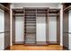 Spacious walk-in closet with custom shelving and rod system at 4304 Berkford Ne Cir, Brookhaven, GA 30319