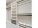 This large walk-in closet has custom shelving and hanging space at 4304 Berkford Ne Cir, Brookhaven, GA 30319