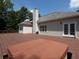 Enjoy the spacious wooden deck featuring a covered hot tub, perfect for relaxation and entertaining at 5 Glenn Eagles Vw, Hiram, GA 30141