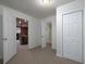 Bedroom in basement with view to media room and full bathroom at 5 Glenn Eagles Vw, Hiram, GA 30141